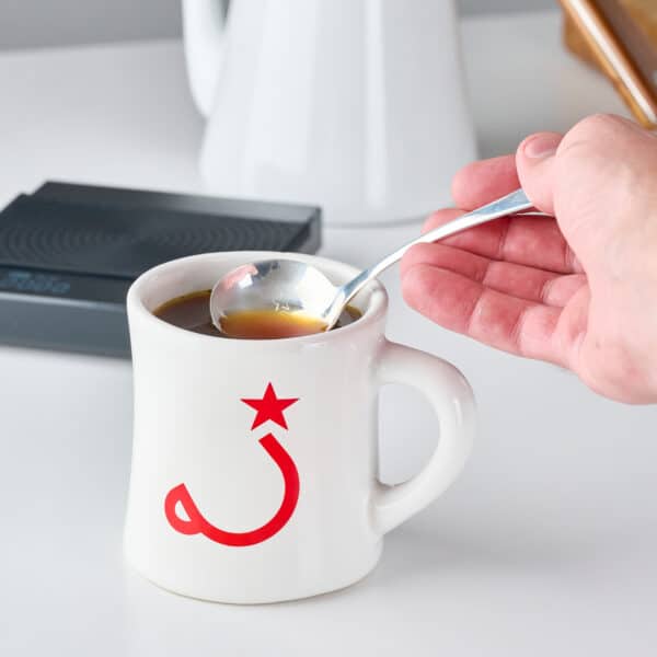 cupping spoon in coffee