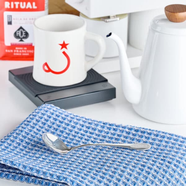 Cupping spoon on blue napkin