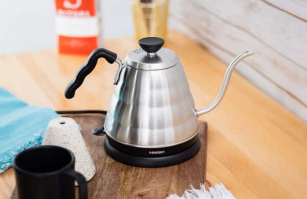 Hario Electric Buono Kettle on a wooden cutting board